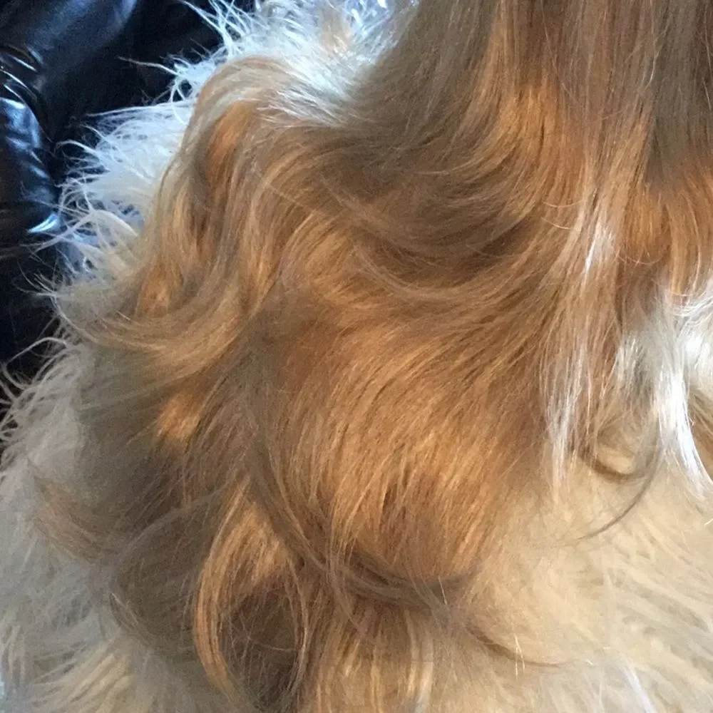 Synthetic ponytail hair piece blondish colors clip on to your hair for length